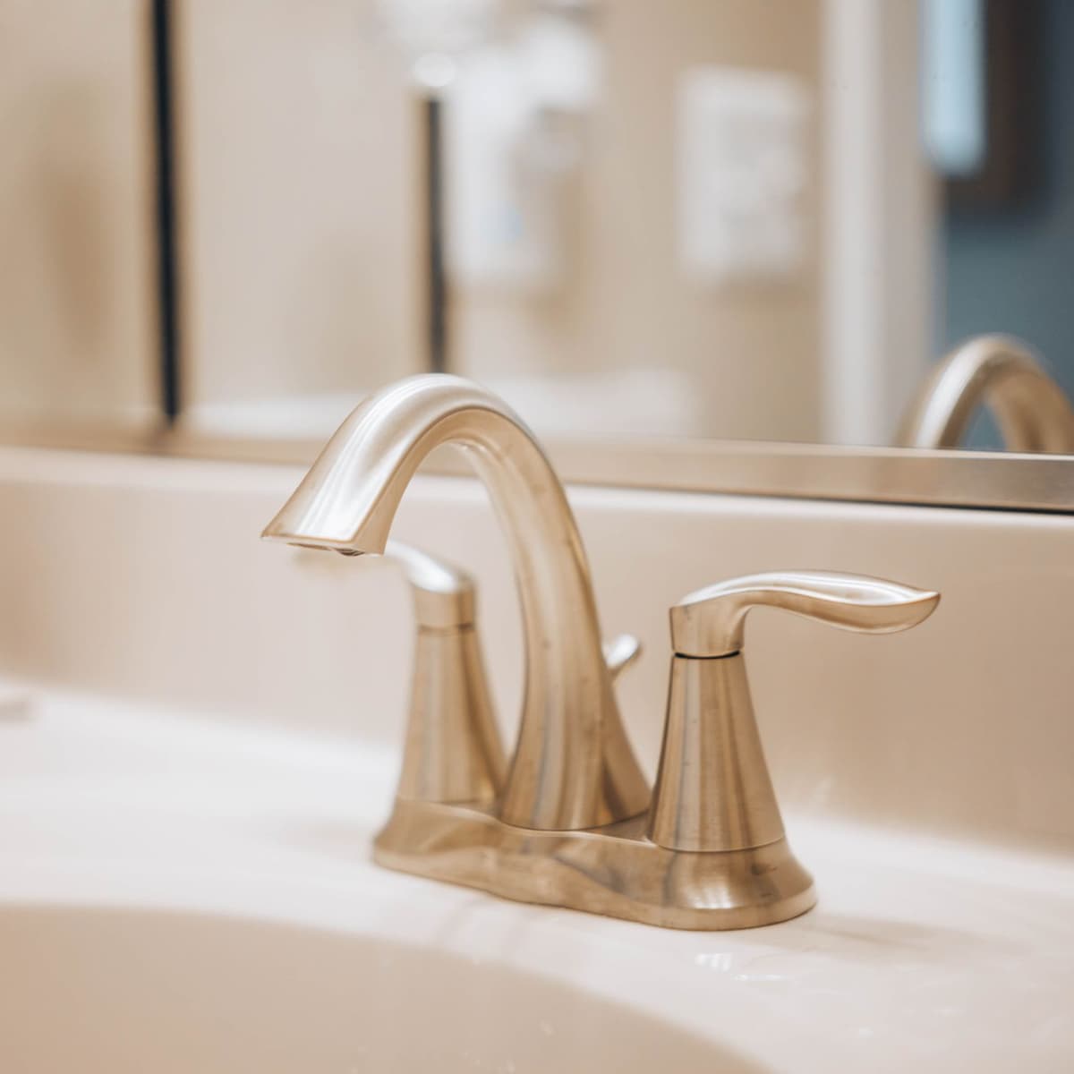 White hard-water scale built up on a kitchen faucet