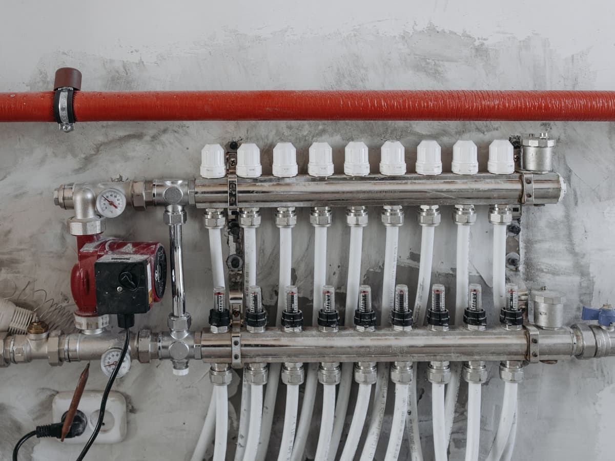 New red and blue PEX water lines with insulation sleeves